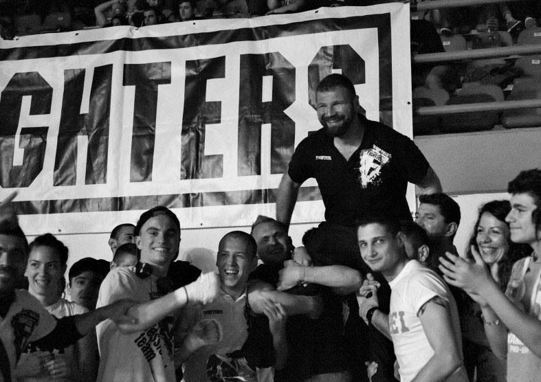 daskalos-celebrating-honours-shoulders